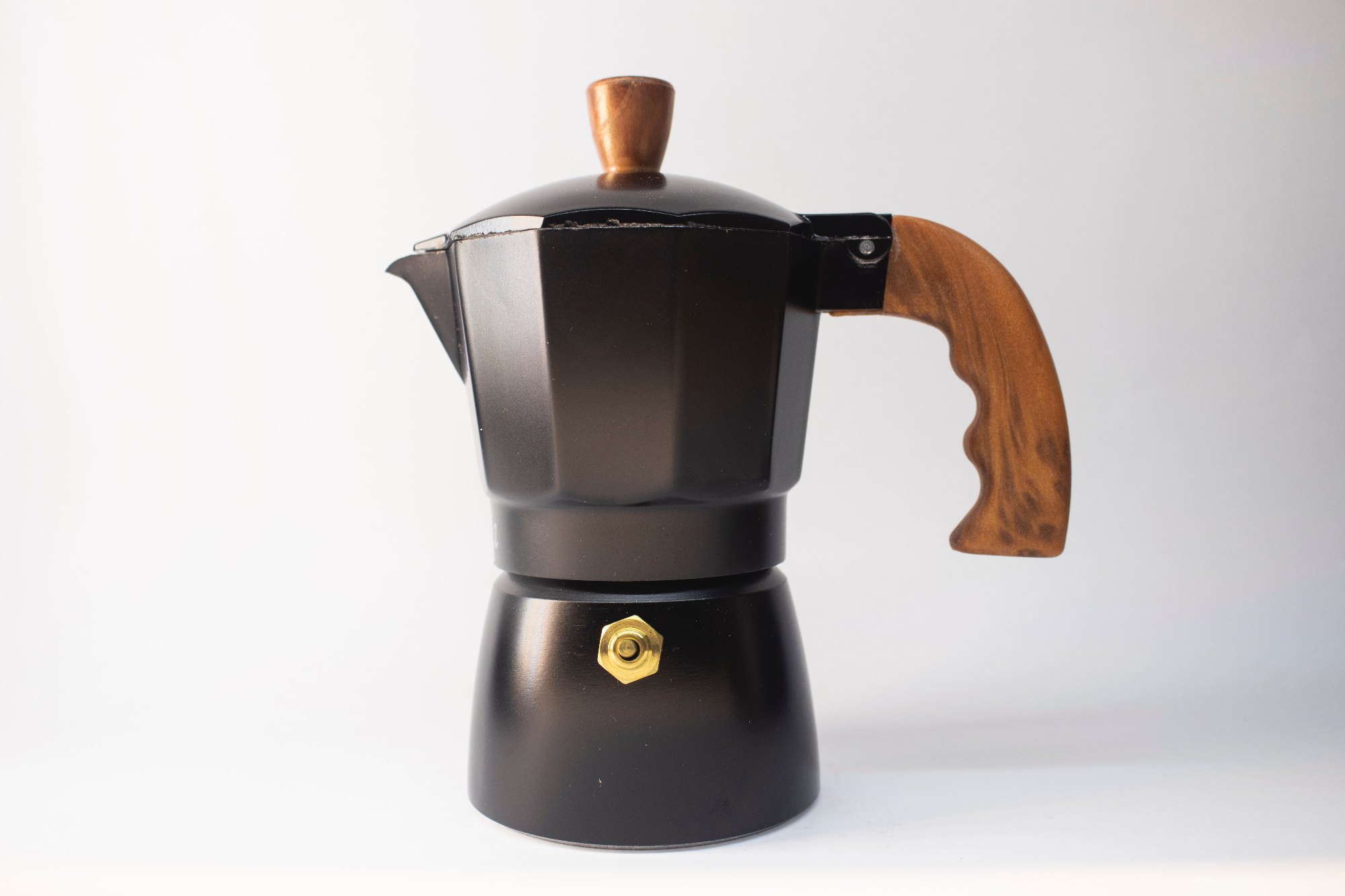 The moka pot on a plain background.